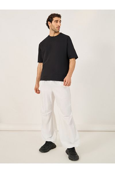 Styli Baggy Parachute Pants with Toggle Cuffed Detail