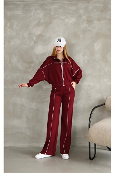 Kayaka triko بدلة رياضية من القماش المشروط بأرجل واسعة مع سحاب