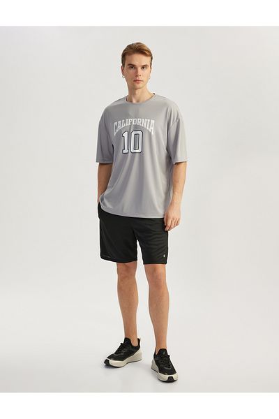 Koton Übergroßes Sport-T-Shirt mit Rundhalsausschnitt und halben Ärmeln mit College-Aufdruck