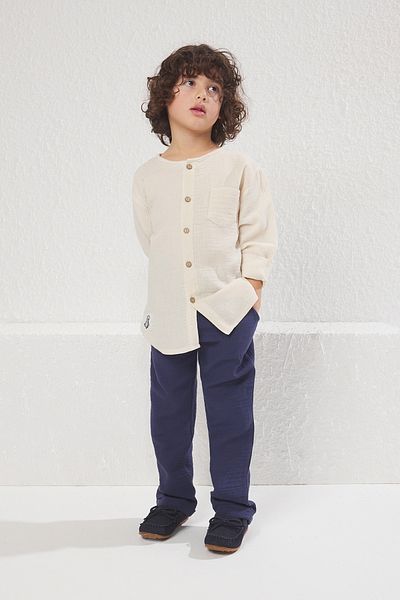TRENDYOLKIDS طقم قميص وبنطلون محبوك من القطن للأولاد - أكمام طويلة، جيوب، طقم سفلي علوي TKDSS24AU00021