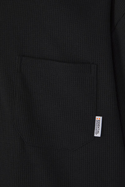 Trendyol Collection Černé oversize střihové polo tričko TMNSS25PO00019