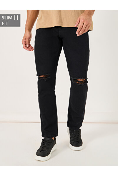 Styli بنطال جينز بقصّة Slim Fit مع تفاصيل ممزقة