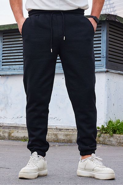 Trendyol Collection Schwarze Fleece/warme Jogginghose – normaler Schnitt, elastisches Bein TMNAW22EA0346