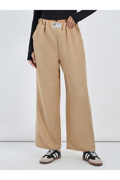 Styli Textured Mid Rise Wide Leg Pants with Badge Detail