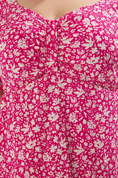 Trendyol Curve Ροζ φλοράλ στάμπα Πλεκτό φόρεμα σε γραμμή Α TBBSS25AH00127