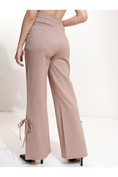 Tokyo Talkies By Styli Mid Rise Flared Trousers with Bow Tie Detail