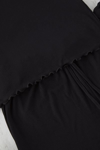 Trendyol Curve Schwarzes, detailliertes, geripptes, gestricktes Baby-Overlock-Pyjama-Set TBBSS25AI00040