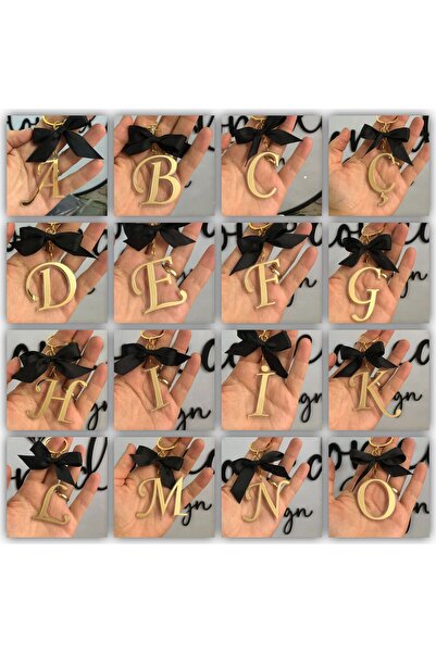 Stoneda سلسلة مفاتيح بحرف واحد مقاس 5 سم مع نموذج مملوء بفيونكة