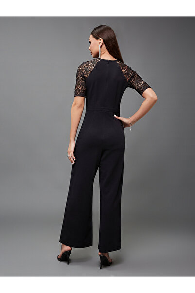 Styli Lace Insert Round Neck Wide Leg Jumpsuit with Cut-Out Detail