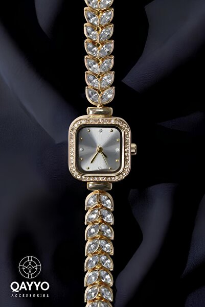 QAYYO ساعة يد نسائية كاجوال بتصميم خاص على شكل ورقة شجر ذهبية اللون وحجر الزركون