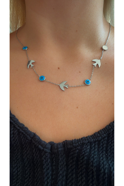 GM TAKI قلادة فضية اللون من الفولاذ مع خرزة عين الشر وشكل طائر