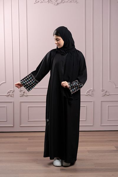 LAVİNİA Lavinia youth abaya with sky-blue, pink, and beige floral embroidery and lace.