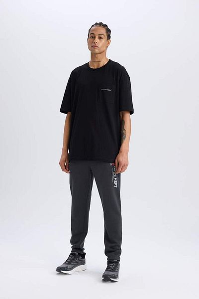 DeFacto Νέα σεζόν DeFactoFit NBA Miami Heat Oversize Φαρδιά Μορφή Ποδηλατικής λαιμόκοψης με στάμπα στην πλάτη
