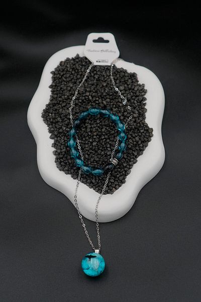 The Collection Glow in the Dark Resin Cloud Necklace and Ocean Bracelet Set
