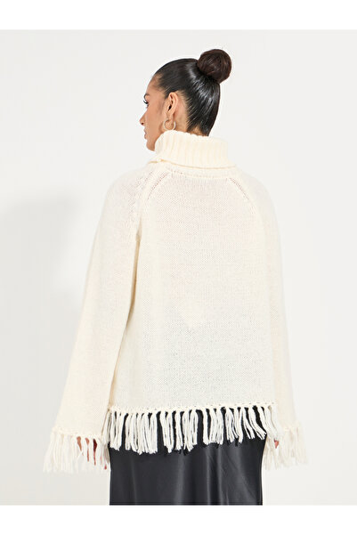 Styli Knitted Turtle Neck Sweater with Tassel Hem Detail