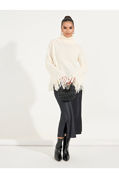 Styli Knitted Turtle Neck Sweater with Tassel Hem Detail