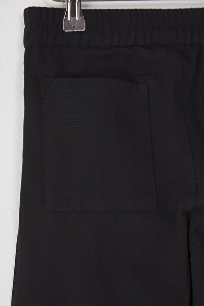 TRENDYOLKIDS Schwarze Basic-Strickhose mit weitem Bein für Mädchen aus 100 % Baumwolle TKDSS25PL00003