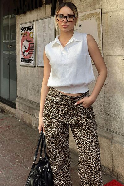 Swist Bluză albă din tricot pentru femei, cu gât polo, cu mâneci zero