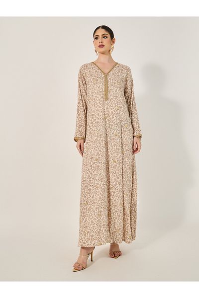 Styli All over print Jalabiya with all ocer gold embroidery and gold lace trims at neck and sleeve hem