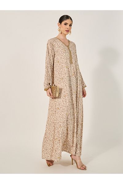 Styli All over print Jalabiya with all ocer gold embroidery and gold lace trims at neck and sleeve hem