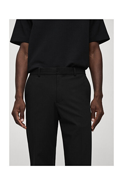 MANGO Man Брюки зі струнким кроєм та еластичною тканиною