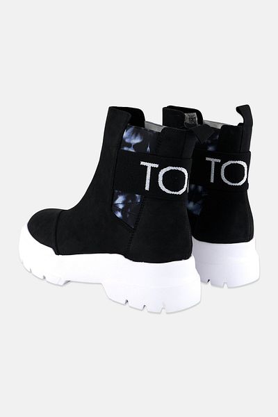 Toms حذاء نسائي من Alpargata Combat سهل الارتداء للكاحل، أسود