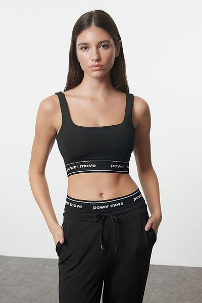 Trendyol Collection Biustonosz sportowy z kwadratowym kołnierzykiem - czarny napis, gumowe detale Thmaw25Ss00011