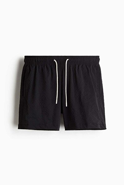 H&M شورت سباحة من قماش السيراكر