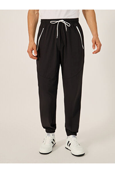 Styli Solid Relaxed Fit Elasticated Cuff Joggers with Contrast Zip detail