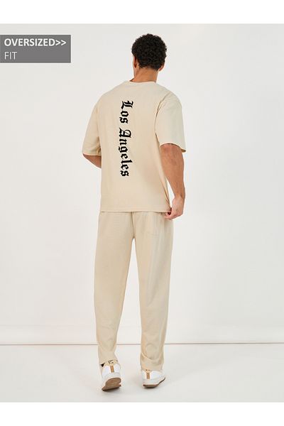 Styli Back Print Oversized T-Shirt and Open Hem Interlock Joggers Co-Ords