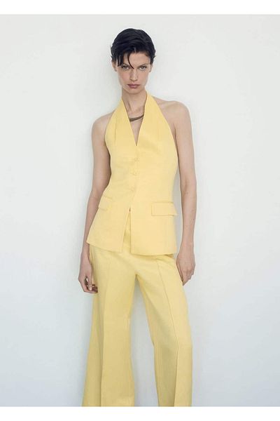 MANGO Woman Παντελόνι flare με λεπτομέρεια πιέτας