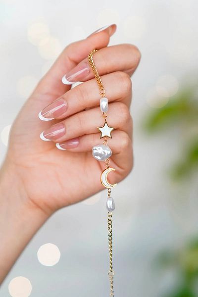 The Collection Moon Star Mother of Pearl Stone Tarnish Gold Women's Steel Bracelet