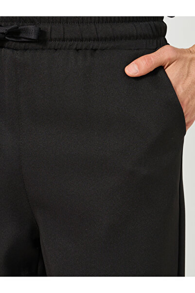 Styli Solid Loose Fit Mid Rise Pants with Drawstring