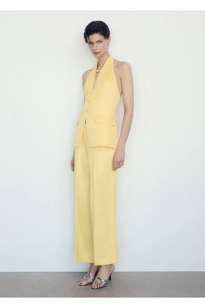 MANGO Woman Παντελόνι flare με λεπτομέρεια πιέτας
