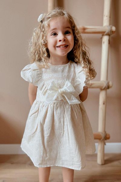 Le Mabelle Beige Short Sleeve Girls Dress with Scallop Detail and Bow - Rosa