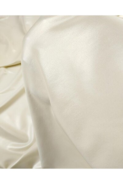 Kumaş Parça Крем кольору блискучий з золотим тисненням джерсі Ширина: 150 см