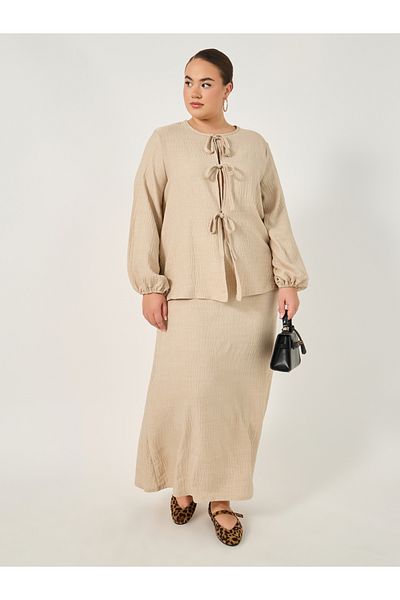 Styli Plus Size Textured Balloon Sleeve Blouse with Bow Tie-Up Detail