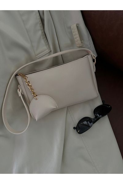 NOTHING Women's Cream Charm Detailed Zippered Hand and Shoulder Baguette Bag Yuumi