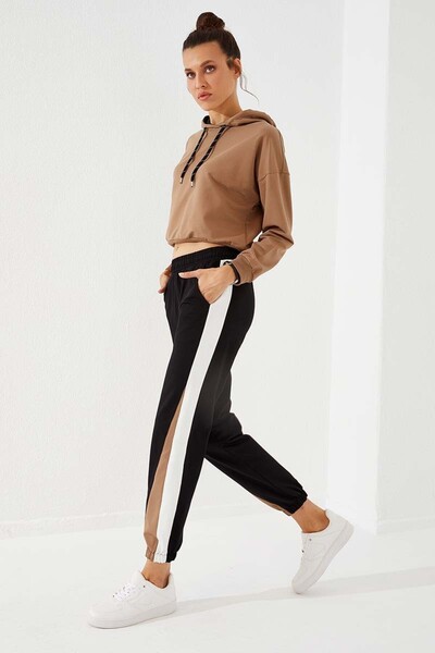 TOMMY LIFE Dámské tepláky černé dvoubarevné pruhované pohodlné tvary s gumou - 94582