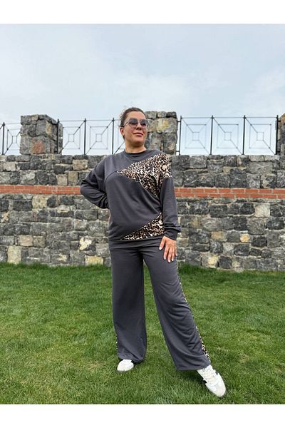 garajmood طقم أسود غير متماثل بتفاصيل جلد الفهد مقاس كبير من الأعلى إلى الأسفل