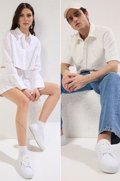 TRENDYOL SHOES Bílé šněrovací unisex tenisky s plochou podrážkou TAKSS25SN00039