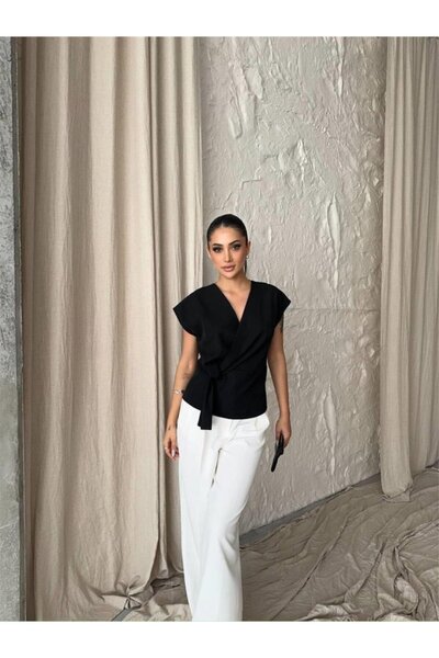 shopivastore بلوزة بدون أكمام من إيدوليكا مع تفاصيل ربط جانبية - أسود