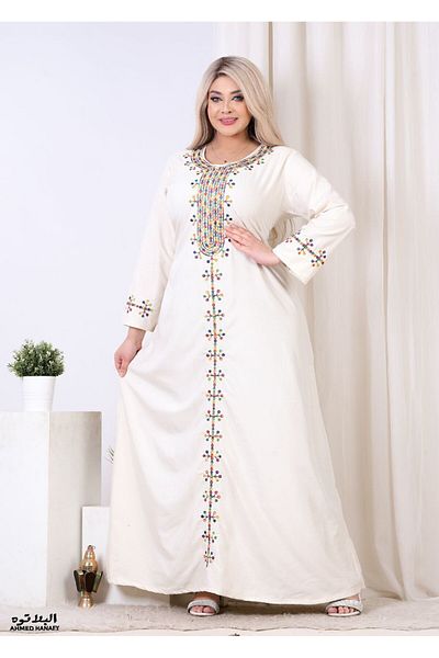 Genrics A comfortable and flowing cotton reception gown with embroidery on the chest and length of the model.
