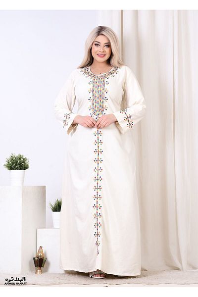 Genrics A comfortable and flowing cotton reception gown with embroidery on the chest and length of the model.
