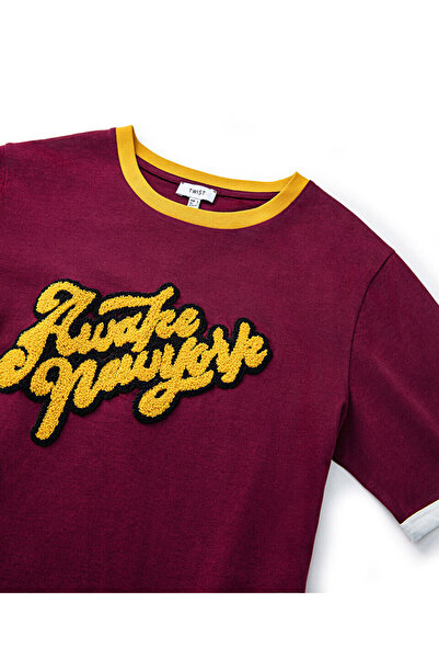 Twist Punch Applique T-Shirt - Stylish and Comfortable Design