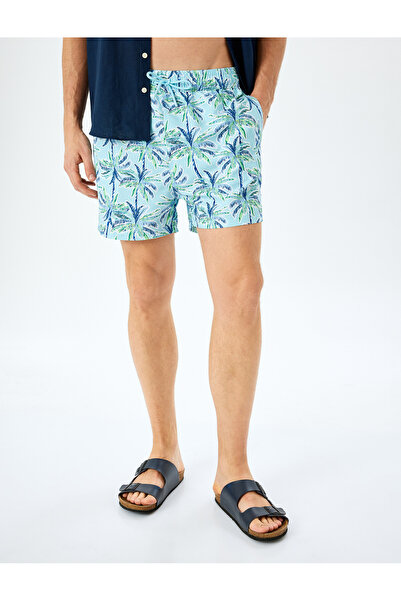 Koton Übergroße, taillierte Badeshorts mit Palmenmuster