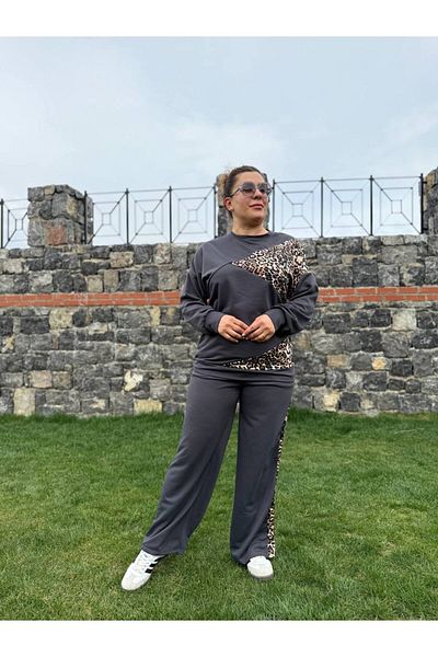 garajmood طقم أسود غير متماثل بتفاصيل جلد الفهد مقاس كبير من الأعلى إلى الأسفل