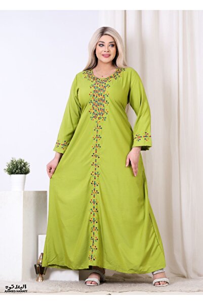 Genrics A comfortable and flowing cotton reception gown with embroidery on the chest and length of the model.