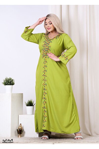 Genrics A comfortable and flowing cotton reception gown with embroidery on the chest and length of the model.