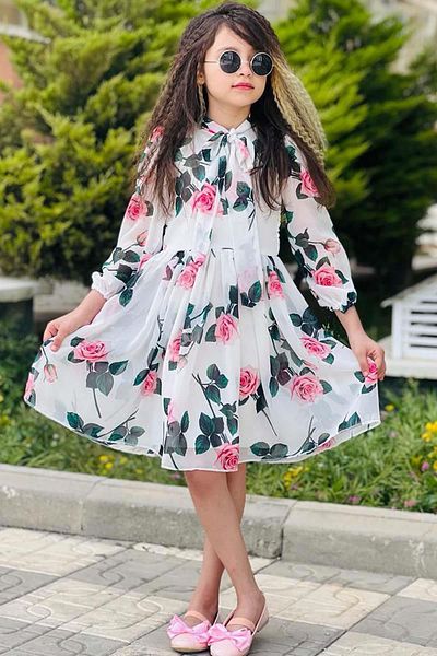 Riccotarz Girl's White Pleated Dress with Tie Collar Detail and Rose Pattern